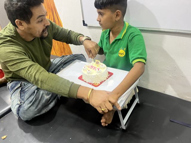 Cutting a birthday cake at the centre
