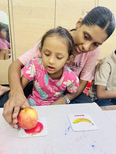 Matching real fruit to picture cards