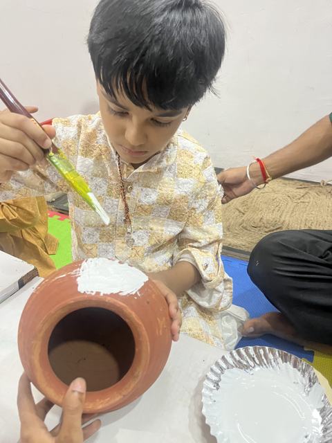 Painting a clay pot