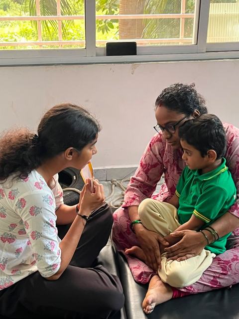 Speech therapy with a child and parent